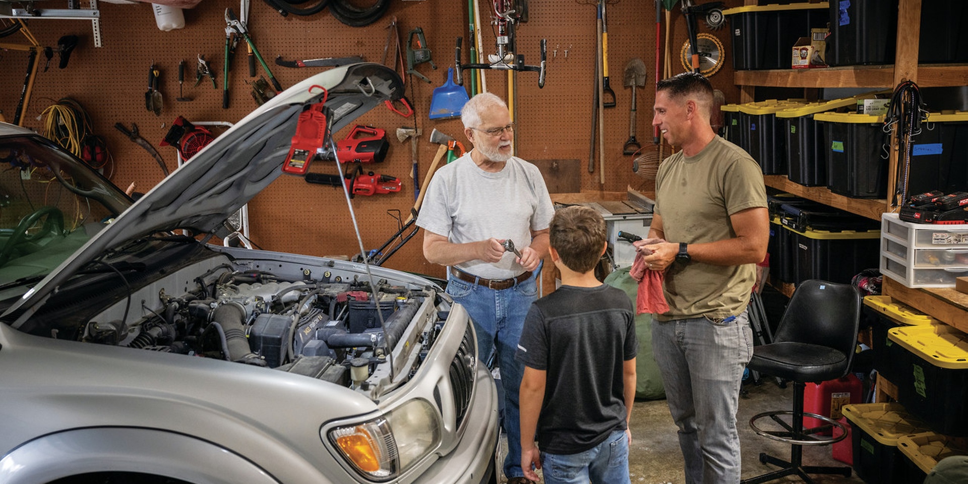 people discussing in a garage