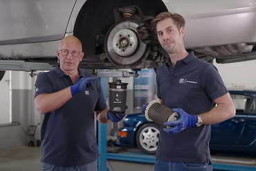Philipp and Mathias with used and new air springs