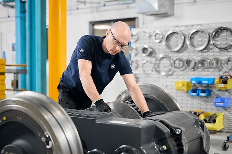 Working on rail part in workshop