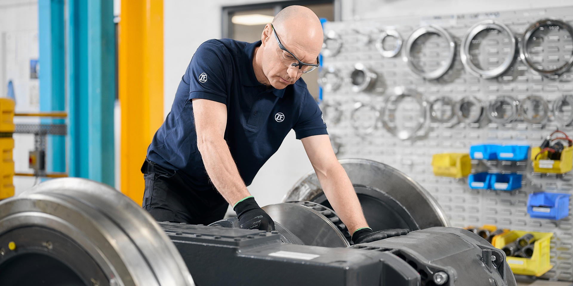 employee inspects machine