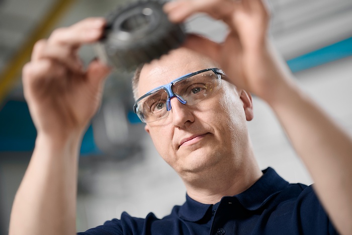 employee inspects item 