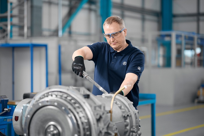 Rail mechanic in the workshop working on rail item