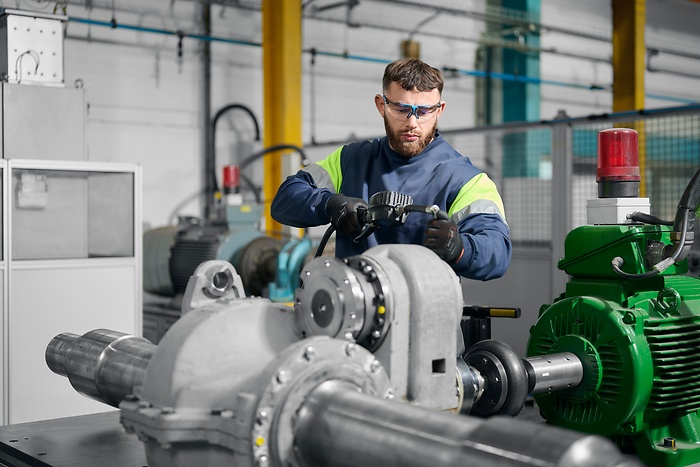 Employee working on part in workshop
