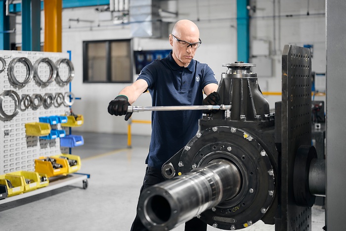 employee works on heavy item