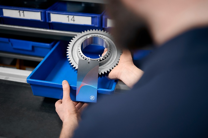 employee packs item in a box