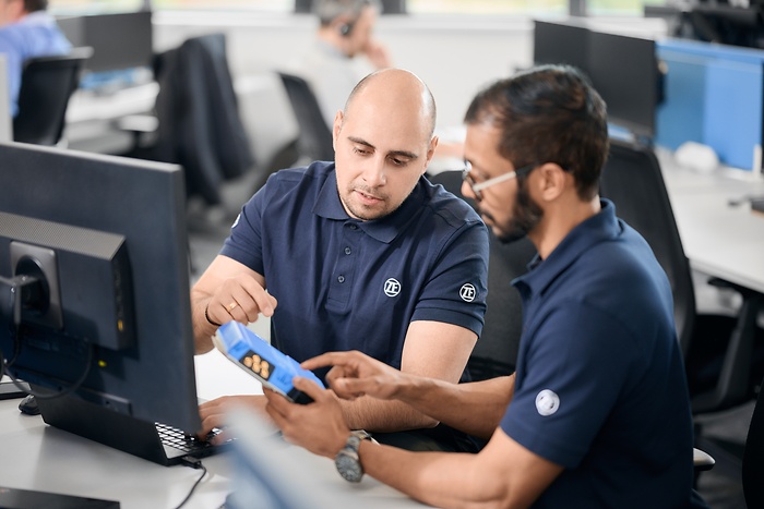 employees discuss over vcu pro